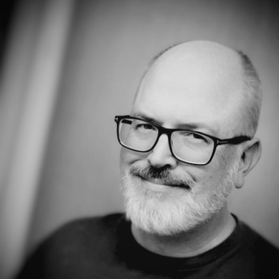 Black and white headshot of Josh Brusin